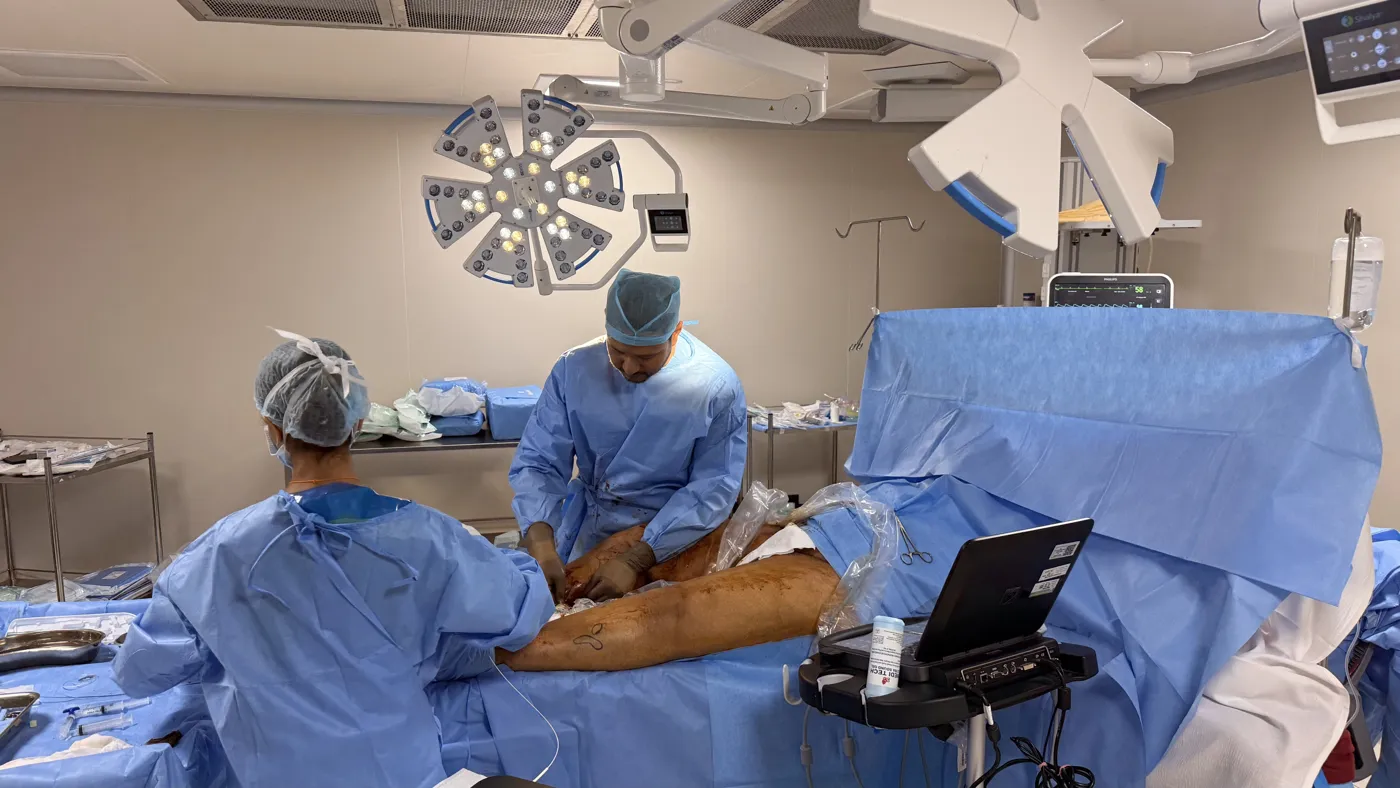Ultrasound-guided venous procedure in progress in an operating theatre